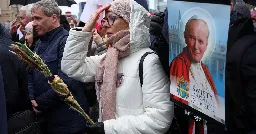 Poles march to defend Pope John Paul II against abuse cover-up accusations